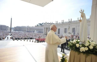 Pope Francis in front of a statue of Our Lady of Fatima in St. Peter’s Square on May 13, 2015. Vatican Media.