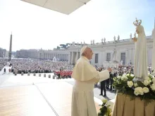 Pope Francis in front of a statue of Our Lady of Fatima in St. Peter’s Square on May 13, 2015.