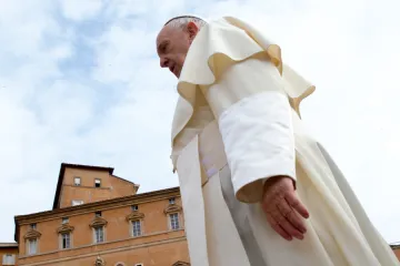 Pope Francis looming, with building in background