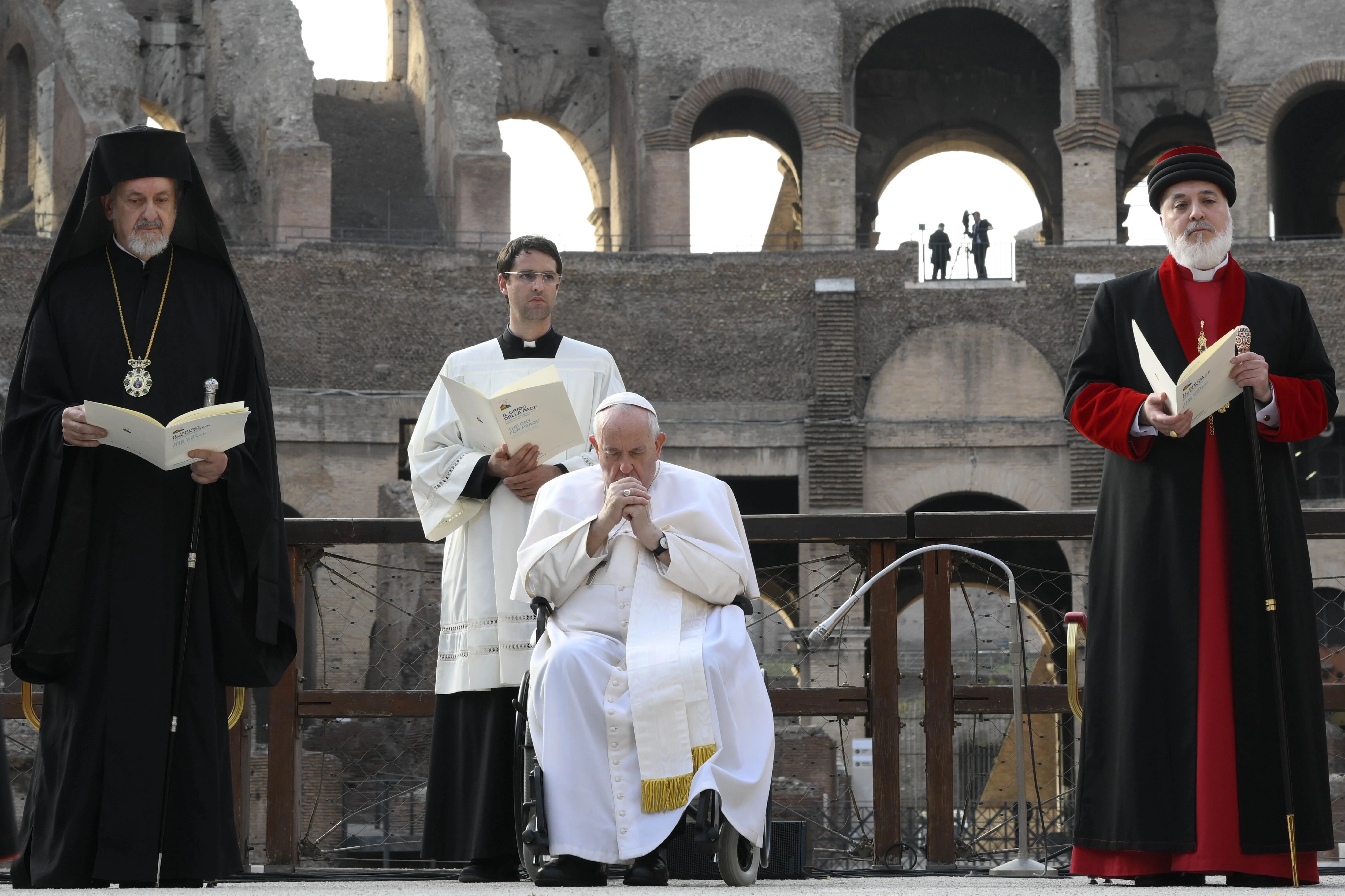 Pope Francis prays during an interreligious peace appeal at the Colosseum in Rome, Oct. 25, 2022.?w=200&h=150