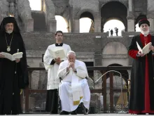 Pope Francis prays during an interreligious peace appeal at the Colosseum in Rome, Oct. 25, 2022.