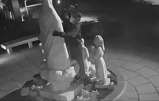 Surveillance footage shows a man hammering at the Our Lady of Fatima statue located outside the Basilica of the National Shrine of the Immaculate Conception in Washington, D.C., on Dec. 5, 2021. Screenshot taken from Metropolitan Police Department video
