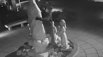 Surveillance footage shows a man hammering at the Our Lady of Fatima statue located outside the Basilica of the National Shrine of the Immaculate Conception in Washington, D.C., on Dec. 5, 2021.