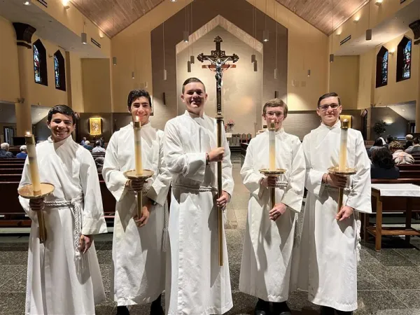 Mass, adoration, and the sacraments play an integral part of the students' lives at Chesterton academies. Many students at the Annapolis Chesterton Academy assist in Mass as altar servers. Credit: Photo courtesy of the Annapolis Chesterton Academy