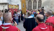 A moment of prayer during the procession through the narrow streets of the Christian quarter of Bab-Touma (St. Paul) in the Old City of Damascus on July 9, 2023, in celebration of the liturgical feast of the Martyrs of Damascus.