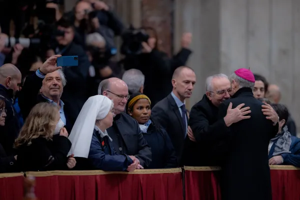 Archbishop Georg Gänswein, the longtime personal secretary of Benedict XVI, embraces one of the estimated 65,000 pilgrims who came to pay their respects to the former pope on Jan. 2, 2023, the first day his body was lying in state in St. Peter's Basilica. Daniel Ibañez / EWTN