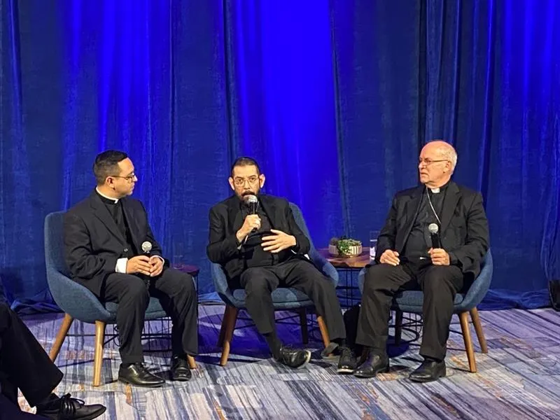 Father Iván Montelongo, a priest from the Diocese of El Paso, Texas; Bishop Daniel Flores of the Diocese of Brownsville, Texas; and Bishop Kevin Rhoades of the Diocese of Fort Wayne/South Bend, Indiana, discuss the Synod on Synodality at the U.S. Conference of Catholic Bishops' fall meeting in Baltimore on Nov. 14, 2023.?w=200&h=150