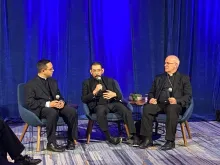 Father Iván Montelongo, a priest from the Diocese of El Paso, Texas; Bishop Daniel Flores of the Diocese of Brownsville, Texas; and Bishop Kevin Rhoades of the Diocese of Fort Wayne/South Bend, Indiana, discuss the Synod on Synodality at the U.S. Conference of Catholic Bishops' fall meeting in Baltimore on Nov. 14, 2023.