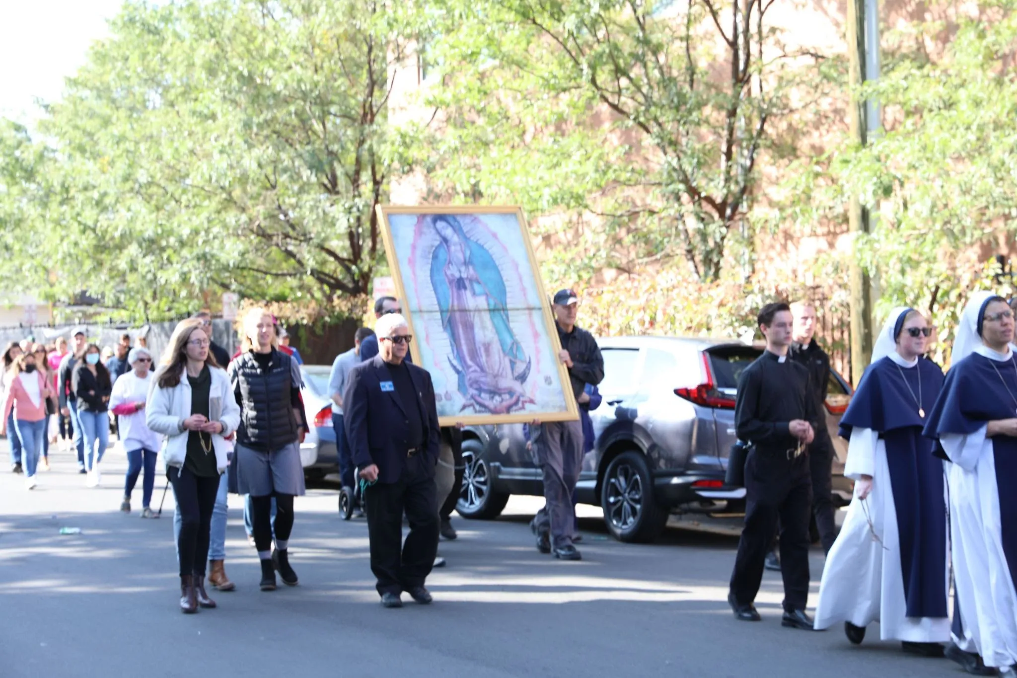 Marchers walk along with an image of Our Lady of Guadalupe during a pro-life Eucharistic Procession Oct. 2, 2021 in Denver.?w=200&h=150
