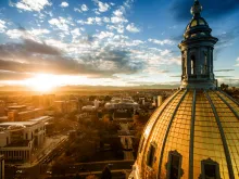 Aerial/Drone photograph of a sunset over the Colorado state capital building. Capital city of Denver.