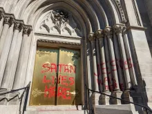 Vandalism on a door of the Cathedral Basilica of the Immaculate Conception in Denver, Colo., Oct. 10, 2021.