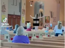 Pro-abortion activists shown disrupting a Mass at St. Veronica Parish in Eastpointe, Michigan. A video said the incident happened on June 12, 2022.