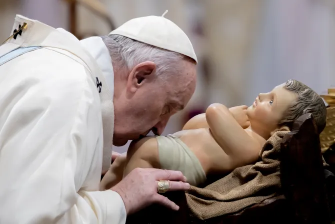 Pope Francis kisses baby Jesus in St. Peter's Basilica on January 1, 2022.