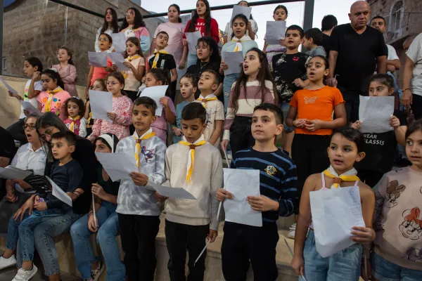 A children's choir at the prayer vigil for peace celebrated on Nov. 9, 2023, at the Terra Sancta High School in Jerusalem. Credit: Marinella Bandini