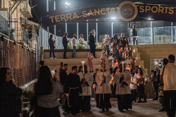 A procession behind the cross took place at the end of the prayer vigil that was celebrated on Nov. 9, 2023, at the Terra Sancta High School in Jerusalem. Credit: Marinella Bandini