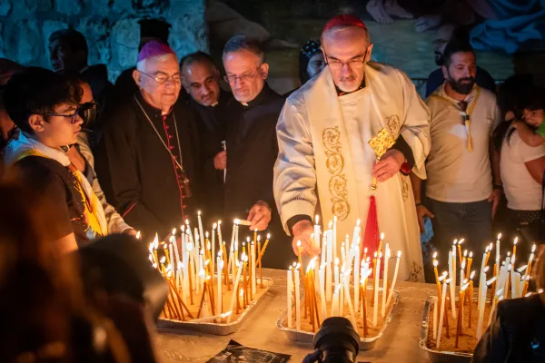 Cardinal Pierbattista Pizzaballa, Latin patriarch of Jerusalem, placed his candle in a brazier at the end of the prayer vigil that was celebrated on Nov. 9, 2023, in Jerusalem. Credit: Marinella Bandini