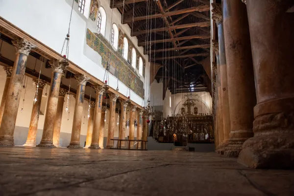 Inside the Basilica of the Nativity in Bethlehem. Since the war started on Oct. 7, pilgrim and tourist groups have cancelled visits and the basilica is always empty. This part of the basilica is guarded by the Greek Orthodox. Credit: Marinella Bandini