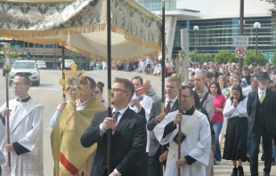 The faithful process behind the Blessed Sacrament across a bridge after leaving the Mayo Civic Center in Rochester, Minnesota, June 2. 2024. Credit: Nick Reller, Winona-Rochester Diocese