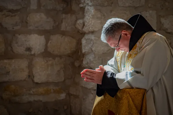 The custos of the Holy Land, Father Francis Patton, prays in St. Catherine's Latin Church, within the Basilica of the Nativity complex on Saturday, Dec. 2, 2023, during his solemn entrance into Bethlehem. Credit: Marinella Bandini