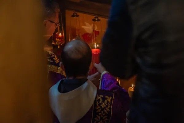 The custos of the Holy Land, Father Francis Patton, lights the first candle of the Advent wreath in the Grotto of the Nativity, inside the Basilica of the Nativity in Bethlehem, on Dec. 2, 2023, during the first vespers of Advent. Credit: Marinella Bandini