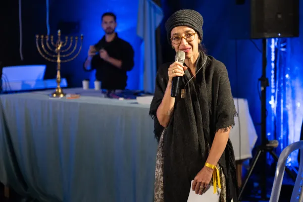 Rabbi Tamar Elad-Appelbaum, founder and leader of Kehilat Zion, speaks during the interfaith event organized by the community on the first night of Hanukkah, Dec. 7, 2023, in Jerusalem. Credit: Marinella Bandini