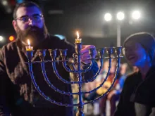 The lighting of the first Hanukkah candle during the interfaith event organized by the Kehilat Zion on the first night of Hanukkah on Dec. 7, 2023, in Jerusalem.