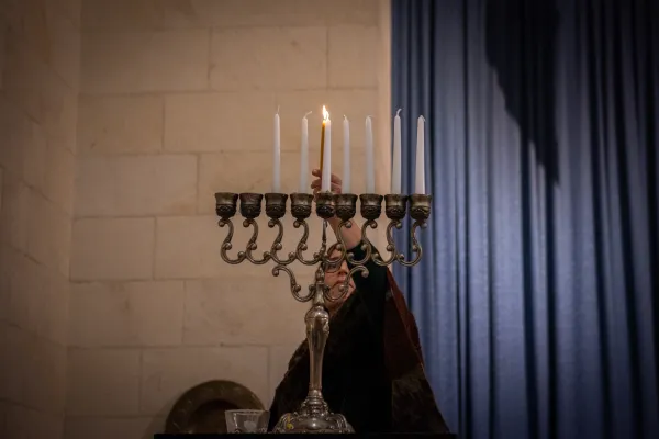 The lighting of Hanukkah candles, during the interfaith event organized on Dec. 12, 2023, in Jerusalem by the Rabbis for Human Rights organization for Hanukkah. Credit: Marinella Bandini