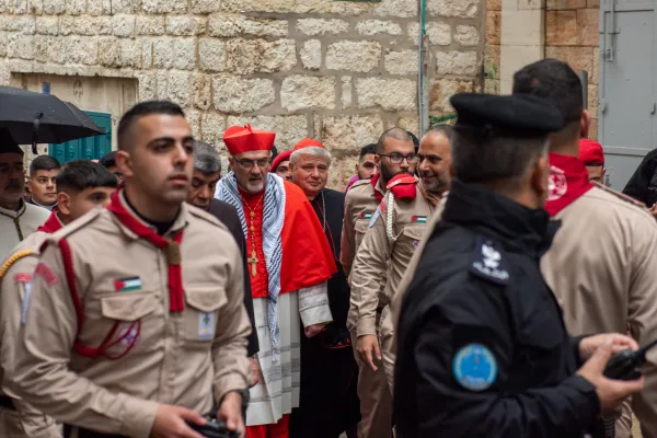 The Latin Patriarch of Jerusalem, Cardinal Pierbattista Pizzaballa, walked along Star Street to the Basilica of the Nativity, in Bethlehem, on Dec. 24, 2023, during the solemn entrance in celebration of Christmas. At his side was Cardinal Konrad Krajewski, the papal almoner, sent by the pope to the Holy Land to express his closeness during this Christmas season. Credit: Marinella Bandini