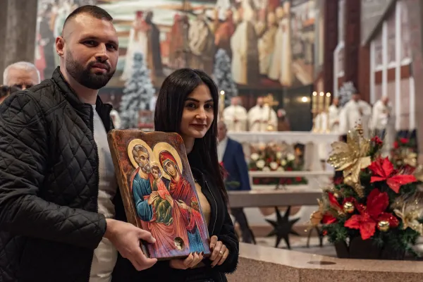 A young married couple expecting their first child processed with an icon of the Holy Family to the place tradition indicates as the house where Jesus grew up with Joseph and Mary, just a few tens of meters from the Basilica of the Annunciation, on Dec. 31, 2023. Credit: Marinella Bandini
