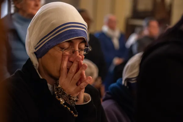 A nun of the order of Mother Teresa (Sisters of Charity) prays during Mass of the solemnity of Mary, Mother of God, on Jan. 1, 2024, in the Pro-Cathedral of the Latin Patriarchate in Jerusalem. A community of Missionaries of Charity, consisting of three sisters, is still present in Gaza today. Credit: Marinella Bandini