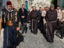 The custos of the Holy Land, Father Francesco Patton, walks through empty Bethlehem streets during the solemn entrance to the Basilica of the Nativity on Jan. 6, 2024.
