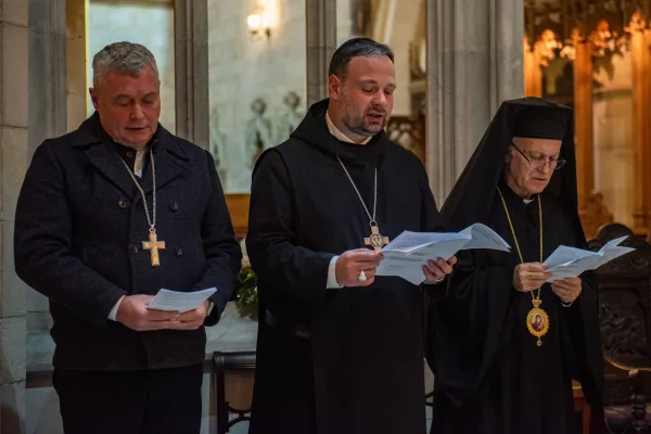 Father Nikodemus Schnabel (middle), abbot of the Benedictine Abbey of the Dormition in Jerusalem, prays at an ecumenical prayer set ice in the Anglican cathedral of Jerusalem on Jan. 21, 2024. Credit: Marinella Bandini