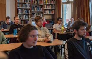 Students of the Studienjahr during a lesson at Beit Josef, the headquarters of the program, within the compound of the Benedictine Abbey of the Dormition in Jerusalem. The Studienjahr program (launched in 1973) is an annual program of ecumenical studies. It brings together every year about 20 German-speaking theology students from all Christians denominations. January 2024. Credit: Marinella Bandini