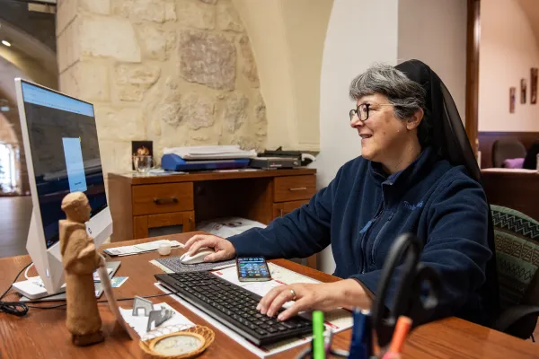 Sister Naomi Zimmermann, FSE, in her office at the Christian Information Center in Jerusalem, whose aim is to provide information on Christianity and on the Holy Land to pilgrims and tourists. Credit: Marinella Bandini