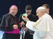Pope Francis holds a puzzle cube during his meeting with young people at a sports arena in Budapest, Hungary, on April 29, 2023.