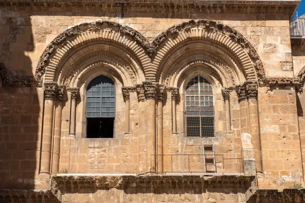 The iconic ladder outside the main facade in the Basilica of the Holy Sepulcher in Jerusalem. It remains a symbol of a distant time and the Status Quo. “The ladder belongs to the Armenians and shows that this area of the façade is their possession, even if the reason why is sort of lost in history,” Father Athanasius Macora said. It would be possible to move it with the agreement of the three Christian communities who "run" the basilica — Catholics, Greek-Orthodox, and Armenians. Credit: Marinella Bandini