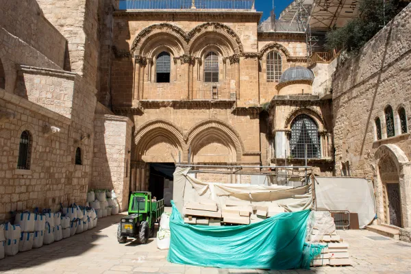 The main entrance to the Basilica of the Holy Sepulcher. Due to ongoing restoration work inside, the courtyard has become a space used in part for the storage of materials. Credit: Marinella Bandini