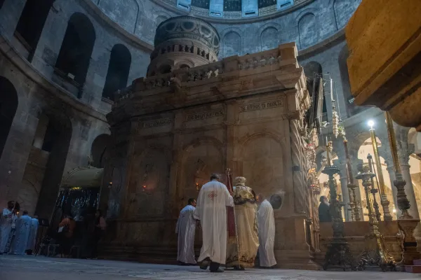 His Eminence Anba Antonios (right), Coptic Orthodox archbishop of Jerusalem, incenses the edicule of the Holy Sepulcher (containing Christ's tomb) during the Sunday Mass on March 17, 2024. Credit: Marinella Bandini