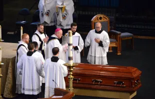 Bishop Carl Kemme of Wichita performs the absolution over the coffin of Father Emil Kapaun after his funeral Mass at Hartman Arena in Park City, Kan., Sept. 29, 2021. Chris Riggs/Catholic Advance