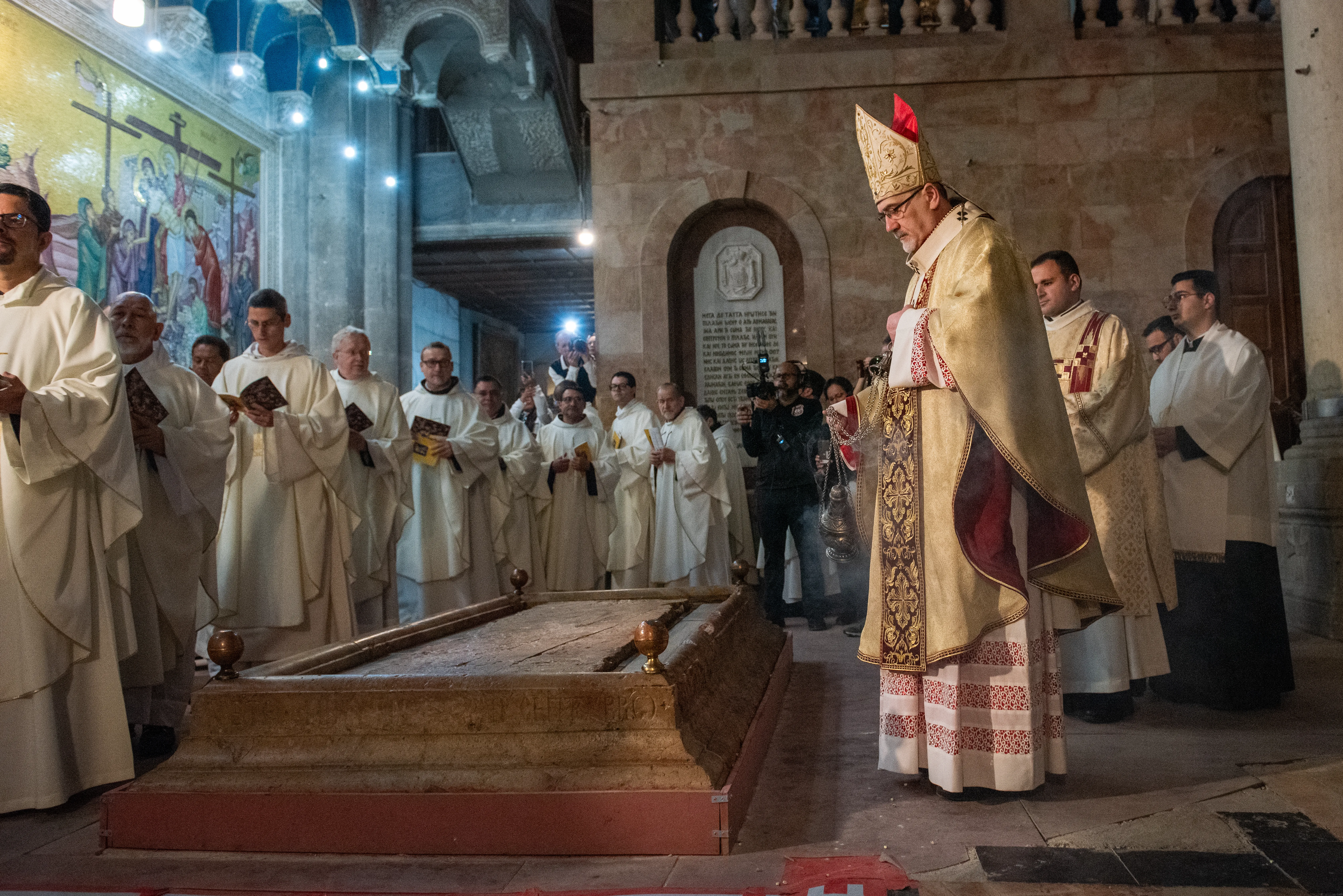 With the incense burned from the newly blessed fire, Cardinal Pierbattista Pizzaballa, the Latin patriarch of Jerusalem, incenses the "Stone of Anointing," located at the entrance of the Basilica of the Holy Sepulcher, where, according to tradition, the body of Jesus was anointed and prepared with aromatic oils for burial. March 30, 2024.?w=200&h=150