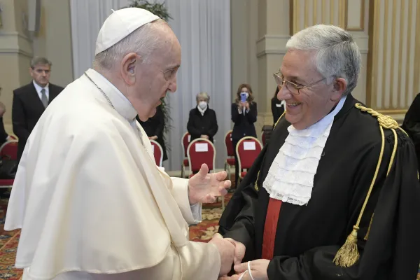 Pope Francis greets the president of the Vatican City State Tribunal, Giuseppe Pignatone. Vatican Media