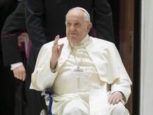 Pope Francis appears in a wheelchair at his general audience on Feb. 28, 2024.