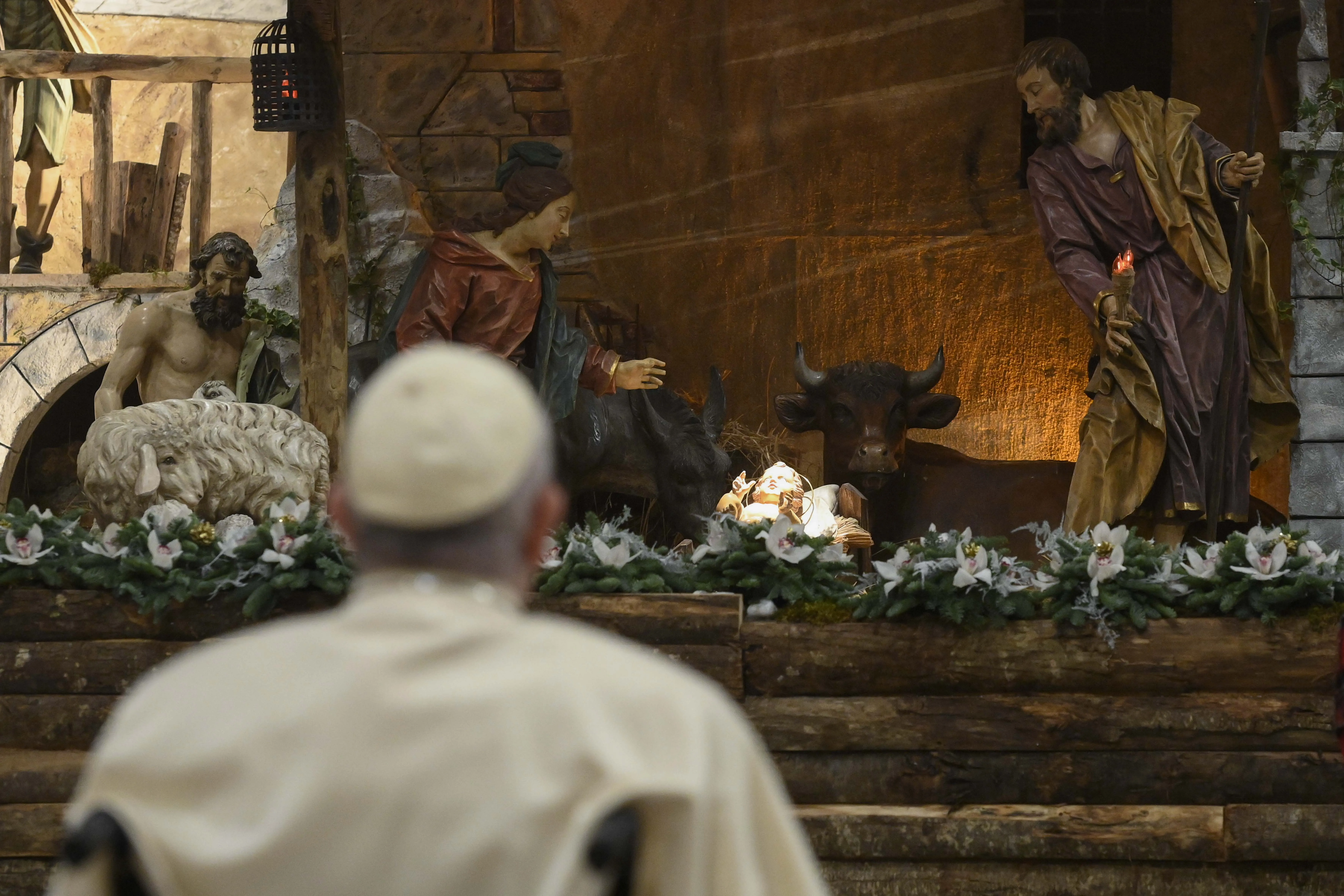 Pope Francis prays in front of the nativity scene after Christmas Mass Dec. 24, 2022.?w=200&h=150