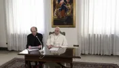 Papal aide Monsignor Paolo Braida reads Pope Francis' prepared remarks for the Sunday Angelus on Dec. 3, 2023, from the chapel at the papal residence at Casa Santa Marta.