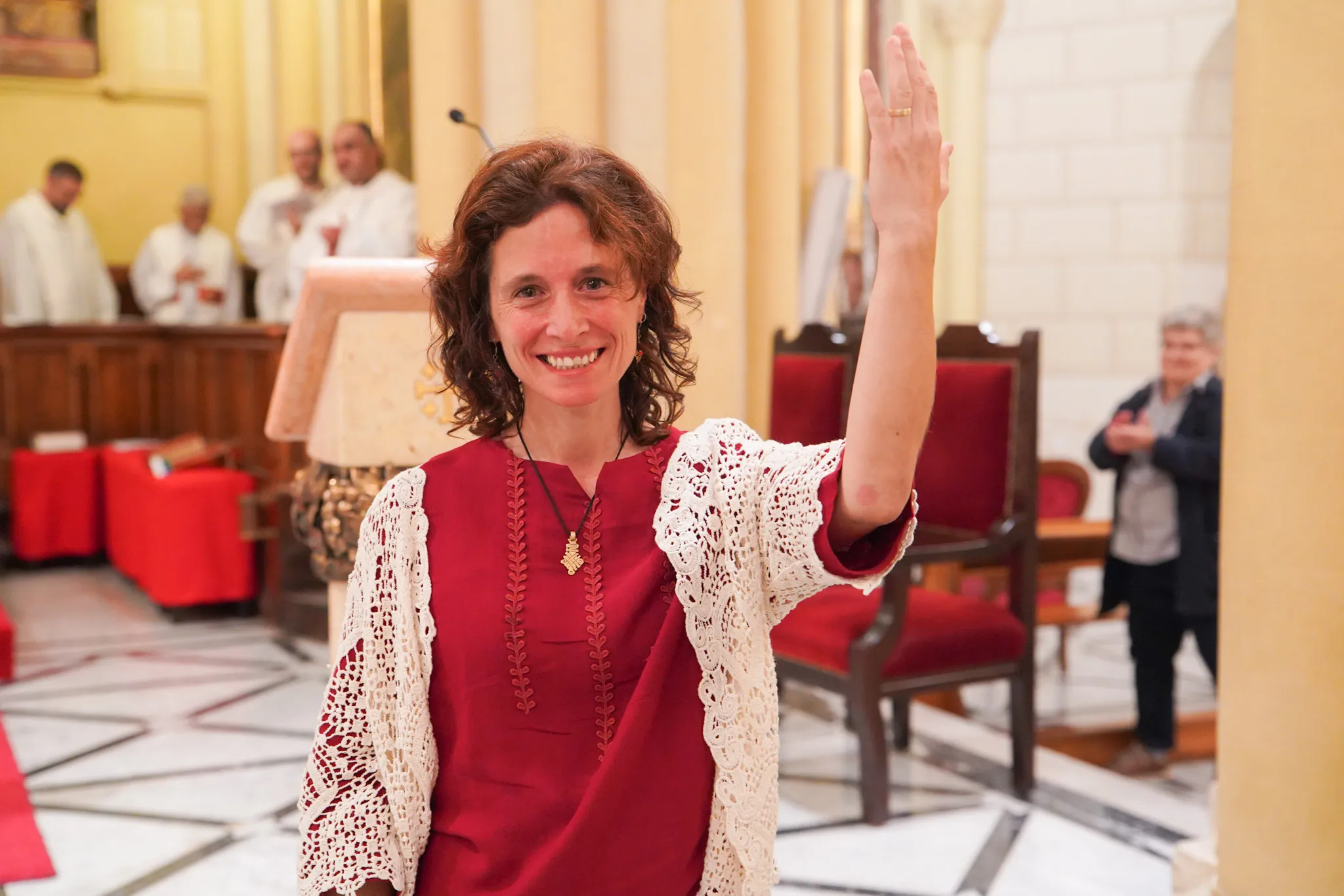 At the end of the Mass of consecration on Nov. 1, 2023, María Ruiz Rodríguez shows the ring symbolizing her membership in the Ordo Virginum. That's the only outward sign of her consecration.?w=200&h=150