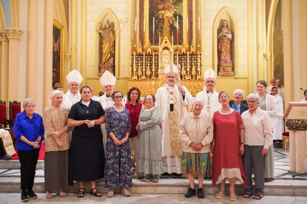 Group photo at the end of the Mass of consecration of María Ruiz Rodríguez in the Ordo Virginum. With her (in the middle, with red shirt) there are other members of the Ordo Virginum, and the bishops of the Latin patriarchate of Jerusalem (from left to right: Giacinto-Boulos Marcuzzo, bishop emeritus; Monsignor William Shomali, general vicar and patriarchal vicar for Jerusalem and Palestine; Cardinal Pierbattista Pizzaballa, Latin patriarch of Jerusalem; Monsignor Rafic Nahra, patriarcal vicar for Israel). Credit: Latin Patriarchate of Jerusalem