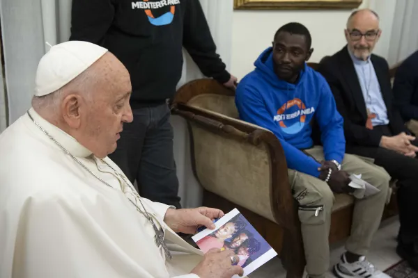 Pope Francis meets with Mbengue Nyimbilo Crepin, a 30-year-old man from Cameroon who shared his story of losing his wife and daughter during a meeting at the pope’s Vatican City residence Casa Santa Marta on Nov. 17, 2023. Credit: Vatican Media