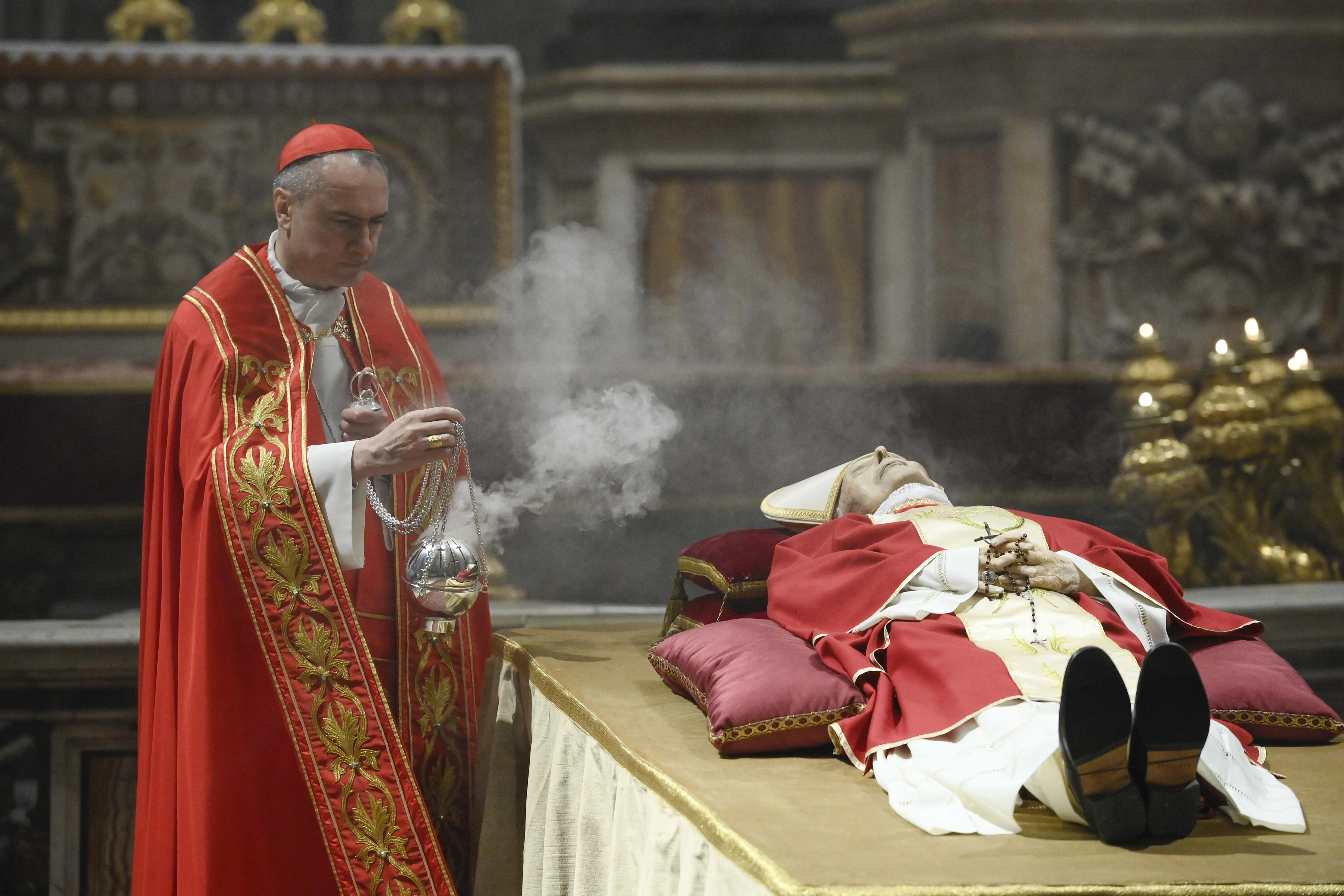 Cardinal Mauro Gambetti, the archpriest of St. Peter’s Basilica, presided over a brief ritual upon the arrival of Benedict XVI’s body in St. Peter's Basilica on Jan. 2, 2023, sprinkling the body with holy water and offering prayers for the repose of his soul.?w=200&h=150