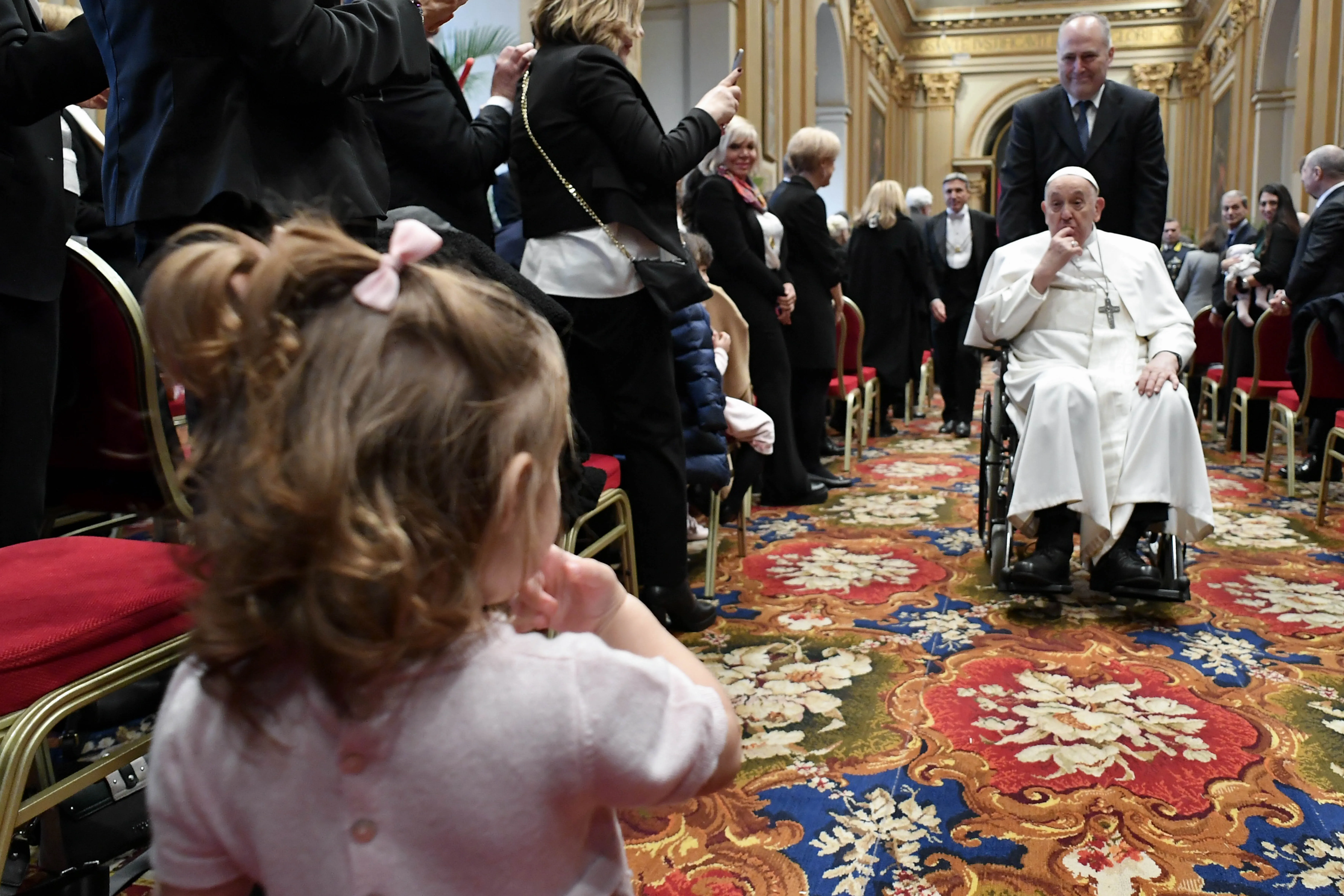 Pope Francis engages with a youngster at the inauguration of the 95th Judicial Year of the Vatican City State on Saturday, March 2, 2024.?w=200&h=150