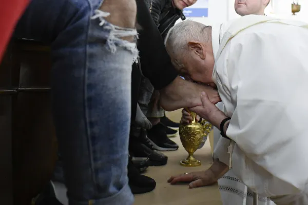 Pope Francis washes and kisses the feet of 12 young men and women, inmates at Casal del Marmo juvenile detention center on Rome’s outskirts, during a Mass of the Lord’s Supper on Thursday, April 6, 2023. Credit: Vatican Media